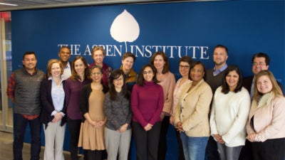 All the Job Quality Fellows standing in front of the Aspen Institute logo