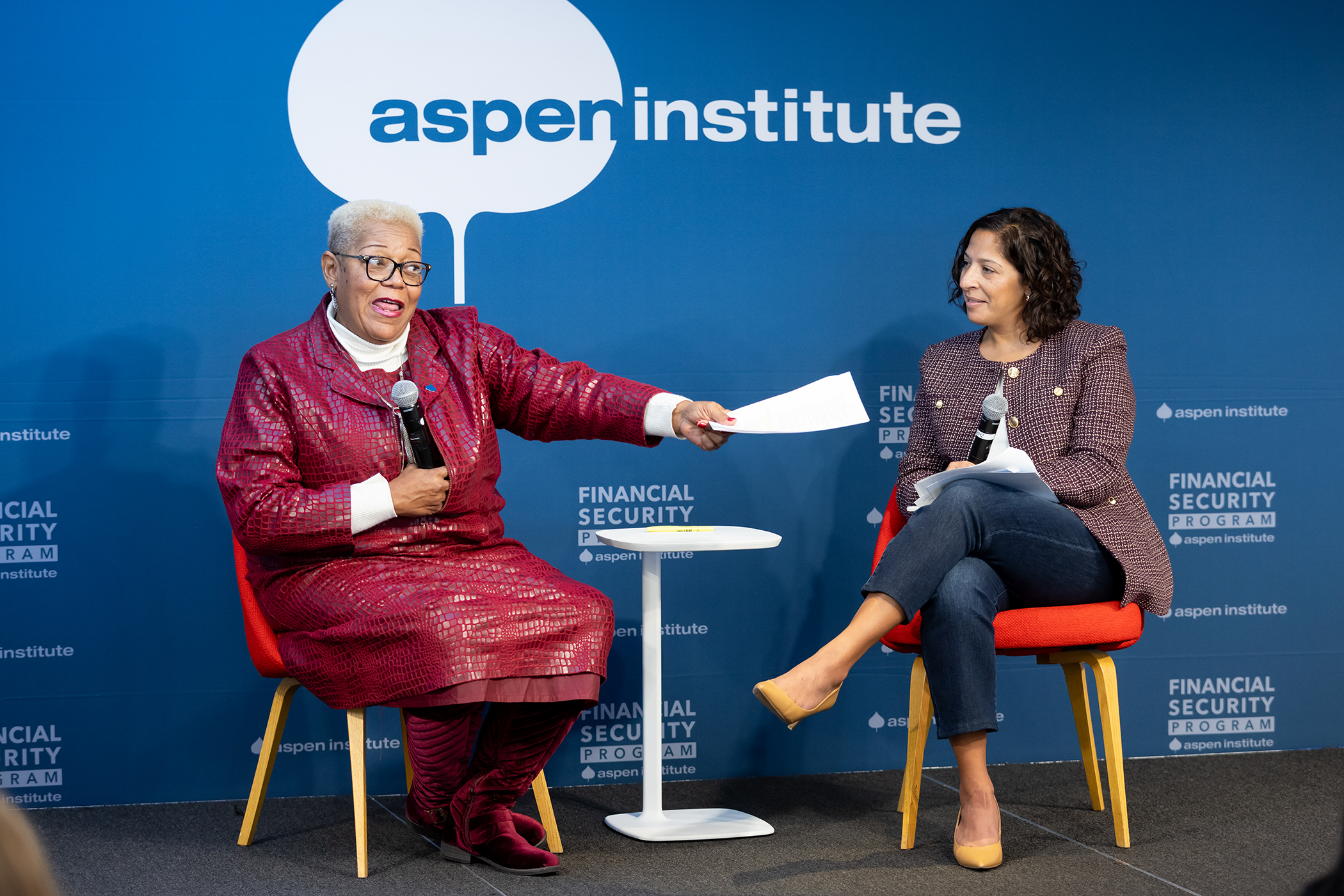 A speaker points to the audience at a panel