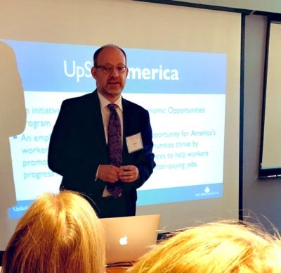 UpSkill America Director Jaime Fall speaks at a New England Board of Higher Education meeting on “Upskilling New England: Bridging the Gap between Higher Education and Employers.”