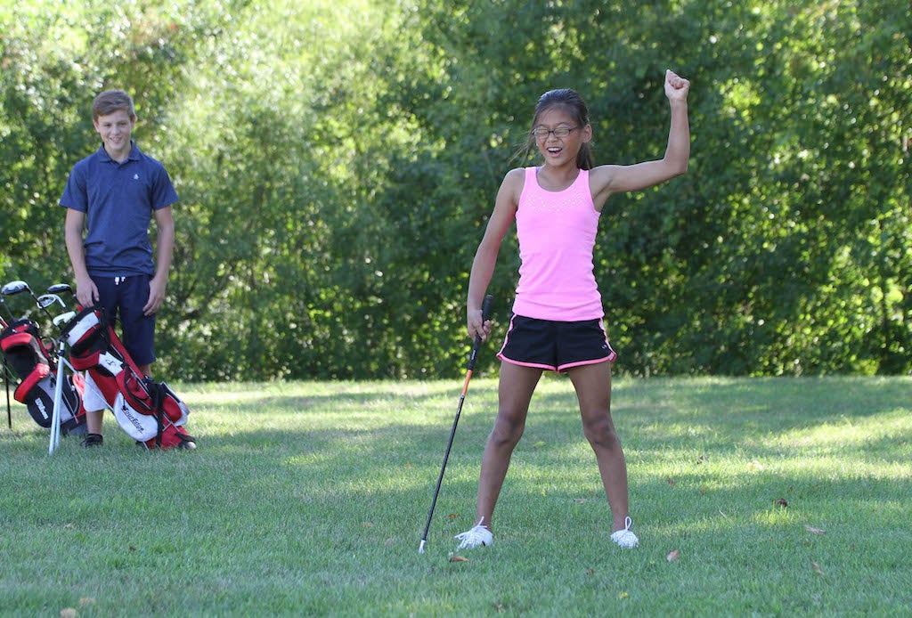 Girl playing golf