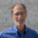 Photo of Corey Rosen wearing a blue shirt