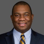 color photo of Sean Matthew wearing a tie