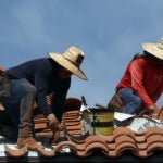People work on the roof of a church during Phoenix's worst heat wave on record on July 26, 2023. (Getty/Mario Tama)