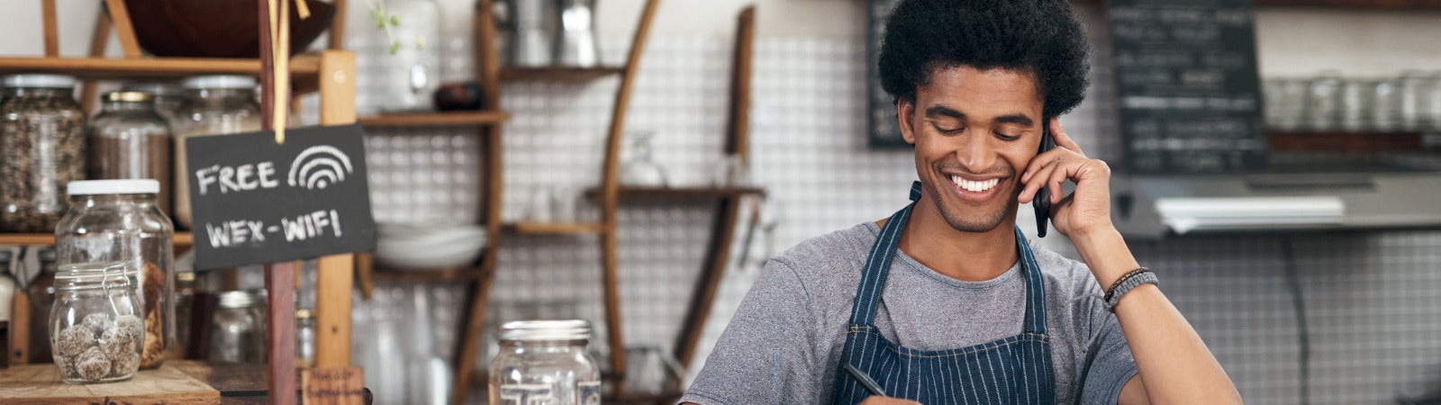 Shareable graphic for EOP’s newest brief about New Tools to Capitalize CDFI growth, co-authored by Brett Simmons of Scale Link and Joyce Klein, Business Ownership Initiative. The image includes a photo of a small business owner writing in a notebook and smiling.