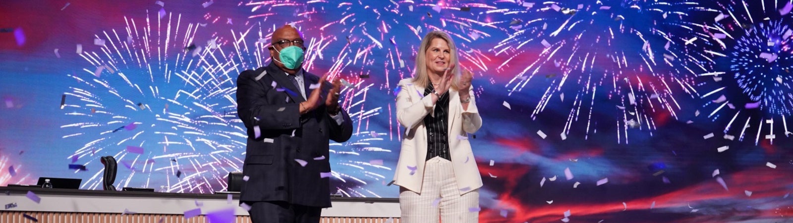 Photo of AFL-CIO President Liz Shuler and Secretary-Treasurer Fred Redmond with fireworks in the background