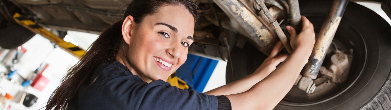 Automotive apprentice working on a car
