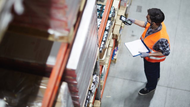 Photo of a worker scanning goods in a warehouse