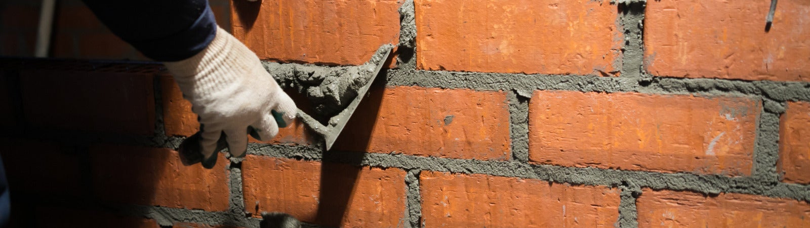 hands and brick wall