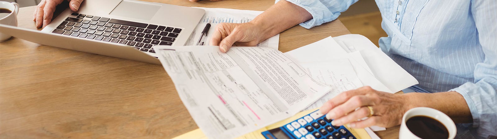 Senior couple checking their bills