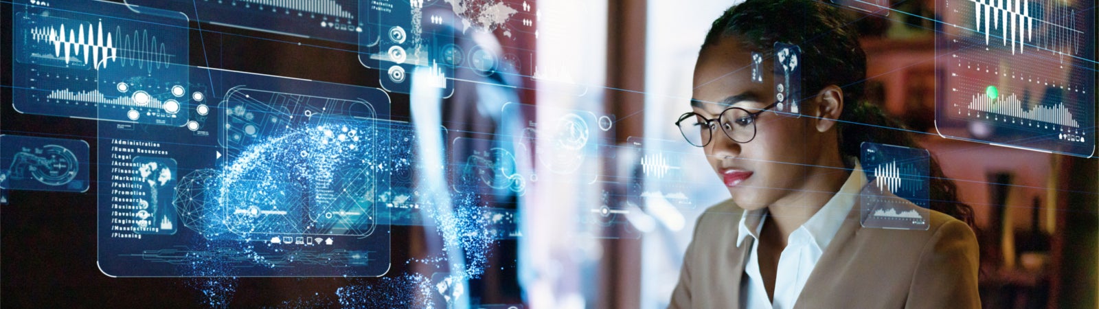 Woman on computer surrounded by data and charts