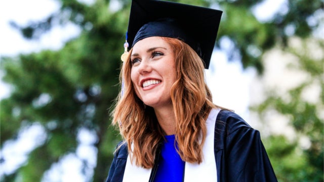 Smiling woman in graduation cap and gown. Photo by Chichi Onyekanne on Unsplash.