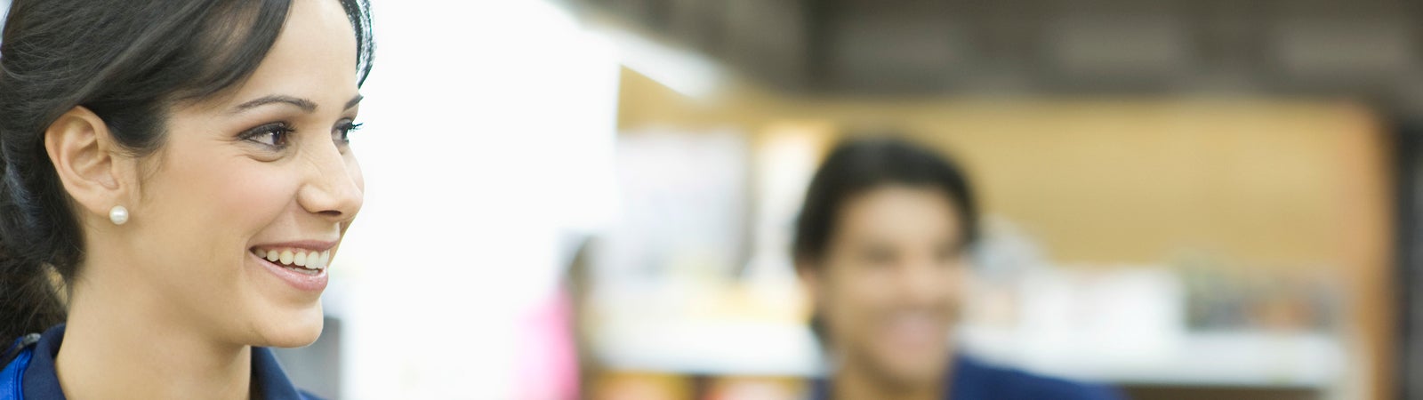 Retail workers smiling with customer