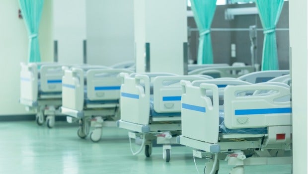 A row of patient beds in a hospital.