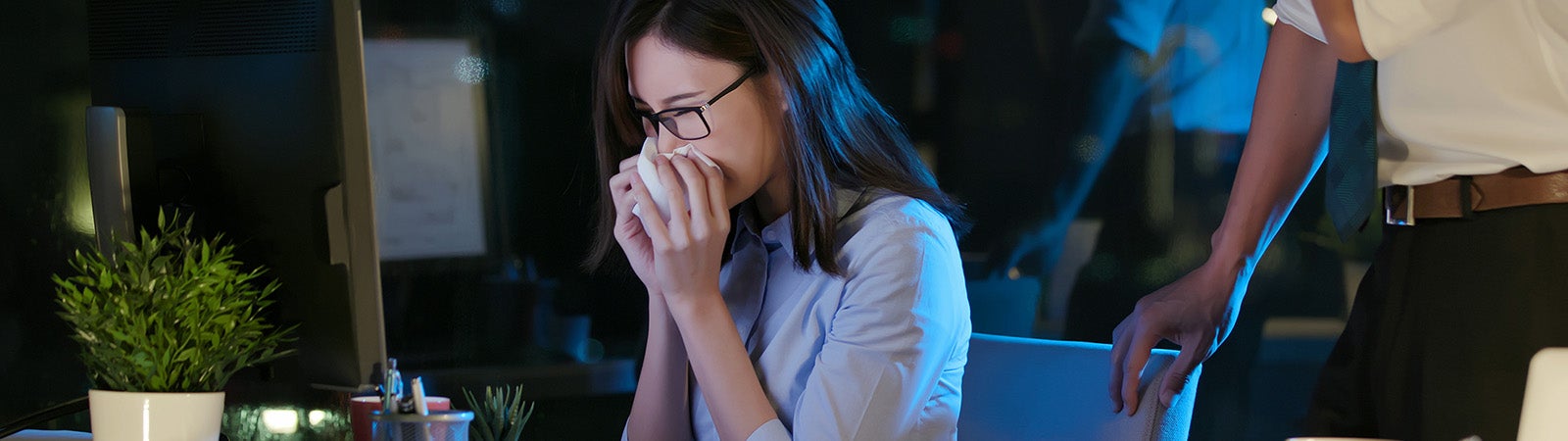 Sick office worker at desk